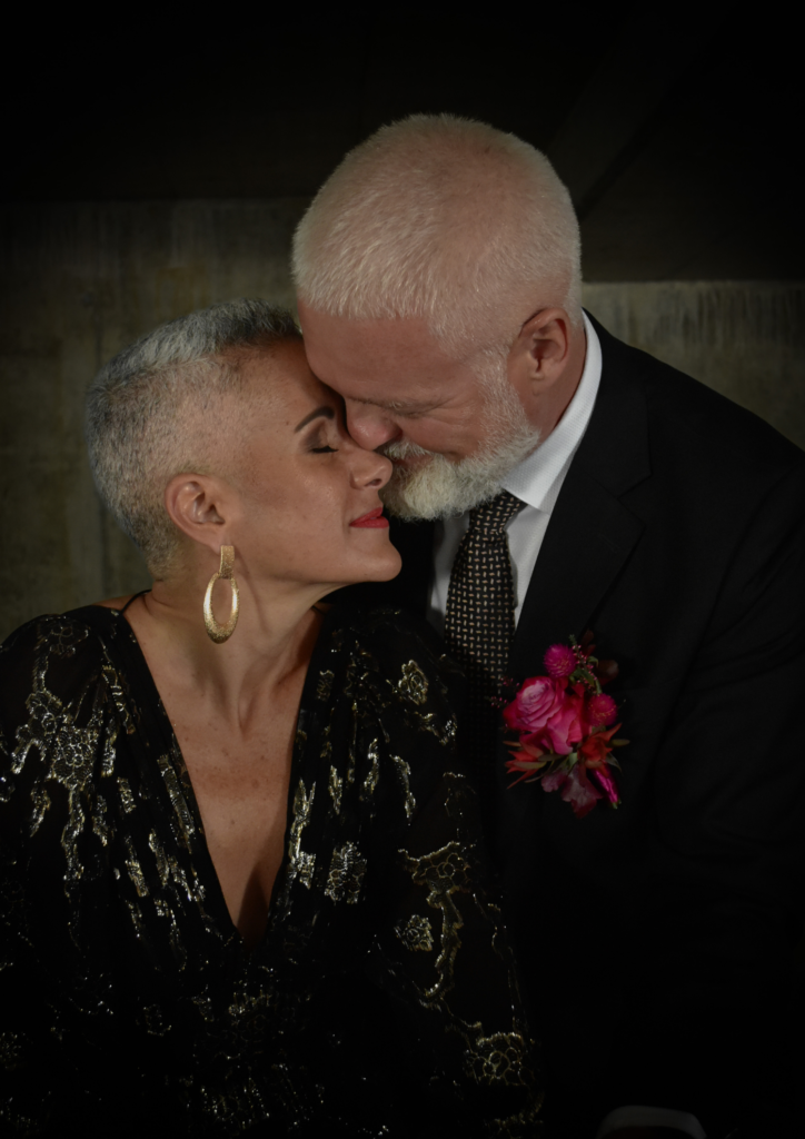 Couple embracing in a romantic pose, showing mutual affection.