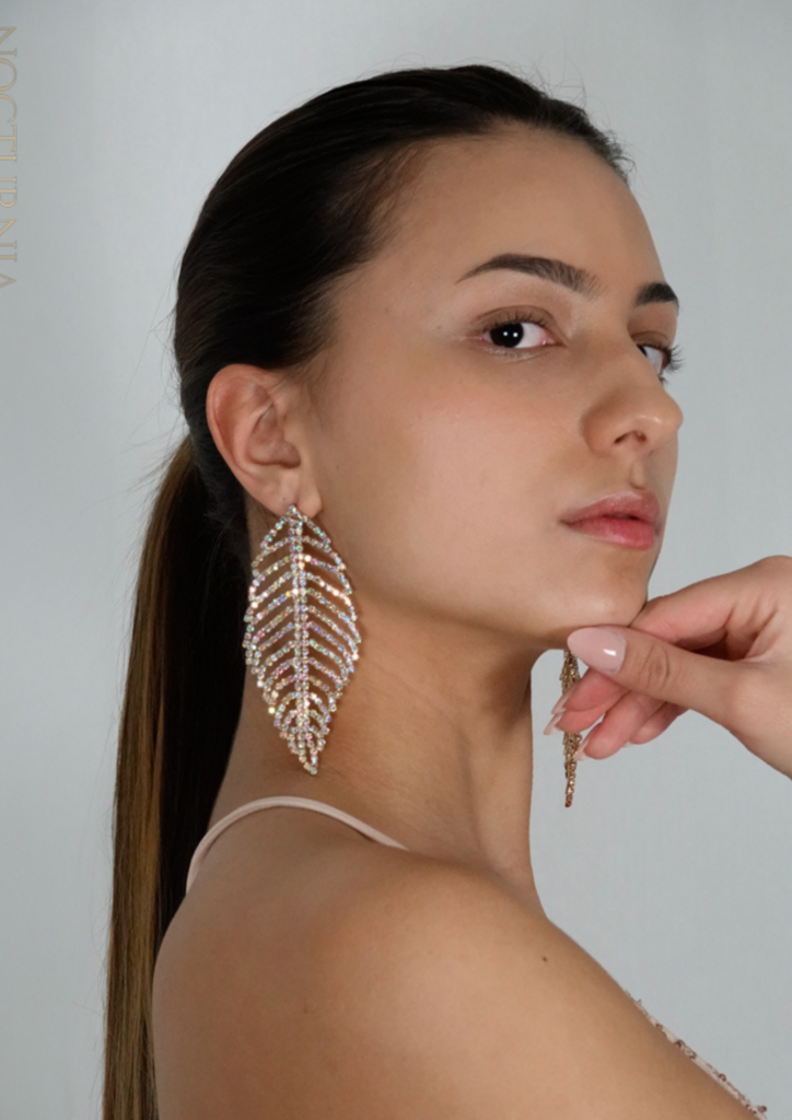 Young woman wearing large statement earrings